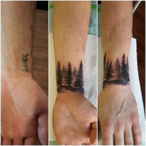 Three-panel image showing a wrist tattoo makeover: first, a small text tattoo; second and third, the tattoo is covered with a scenic woodland silhouette featuring pine trees and a sunset sky.