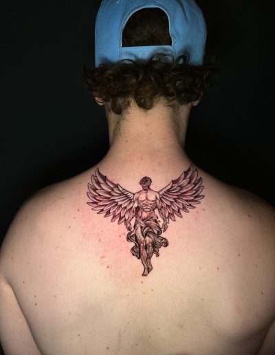 Back tattoo of a winged man, detailed angel design