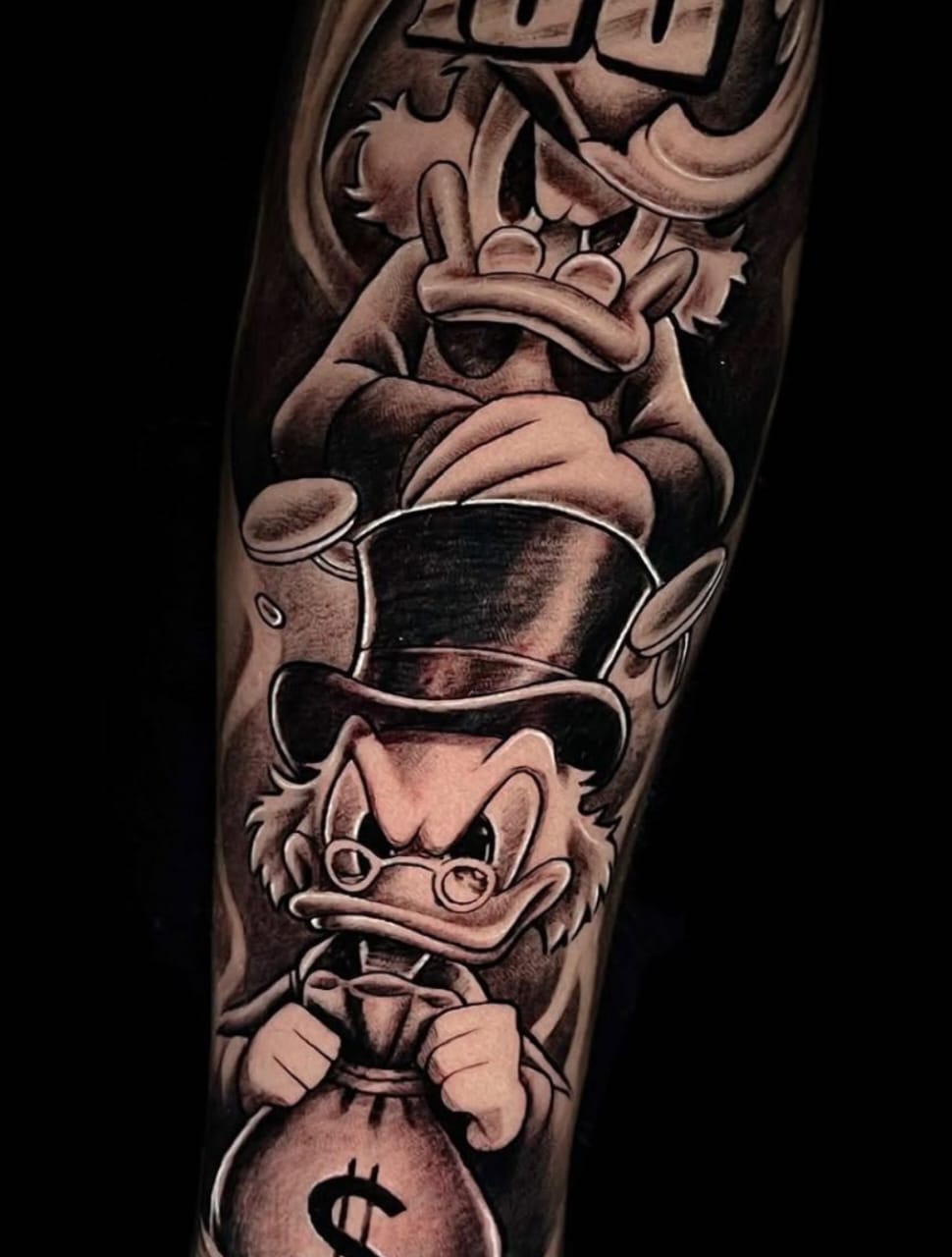 black-and-grey-scrooge-mcduck-holding-money-bag-tattoo Man's arm displays a black and gray tattoo of Hercules wearing the Nemean lion skin.
